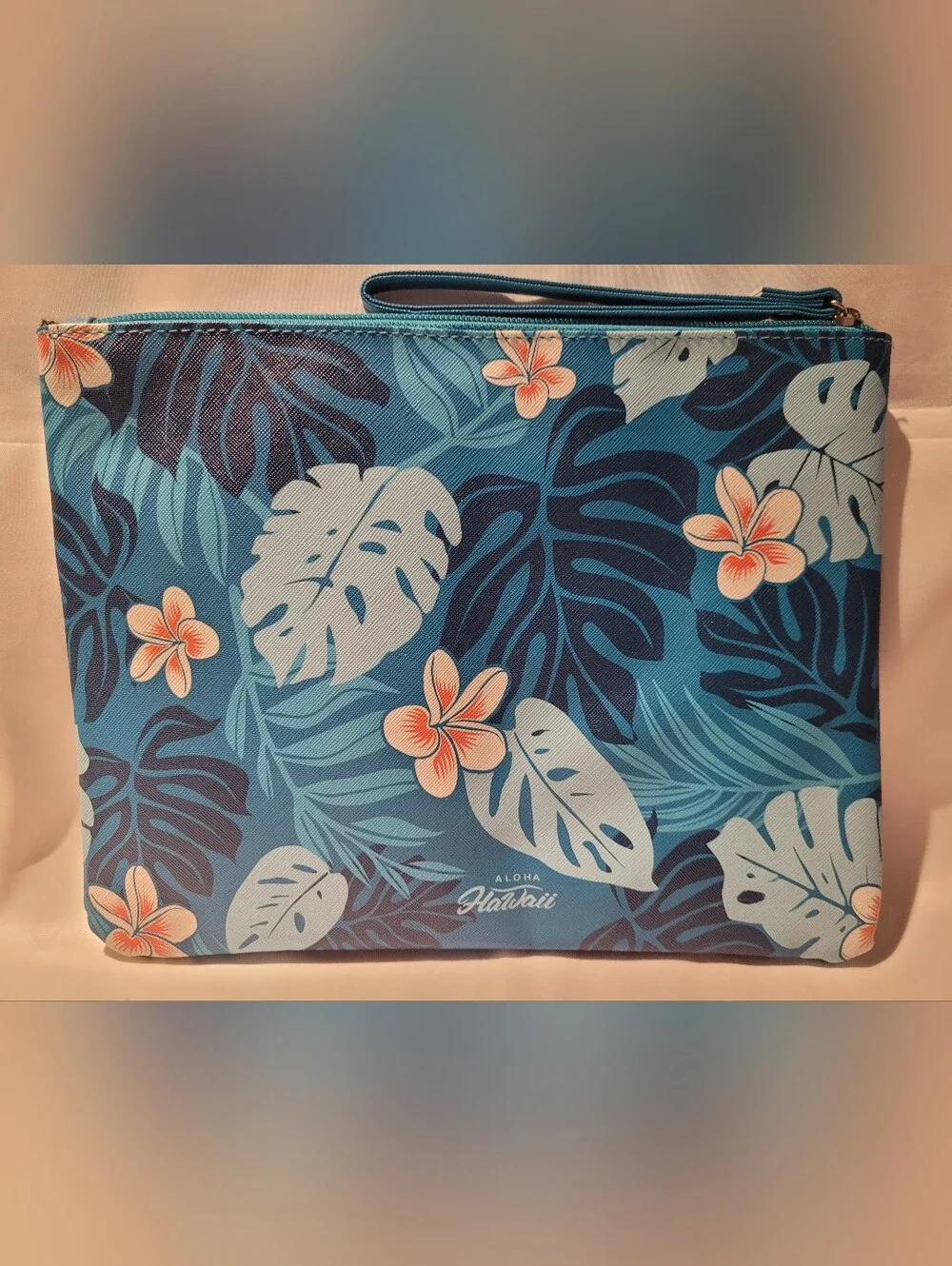 Clinique Set, Blue Hawaii, and Pink/Orange  Pouches.
